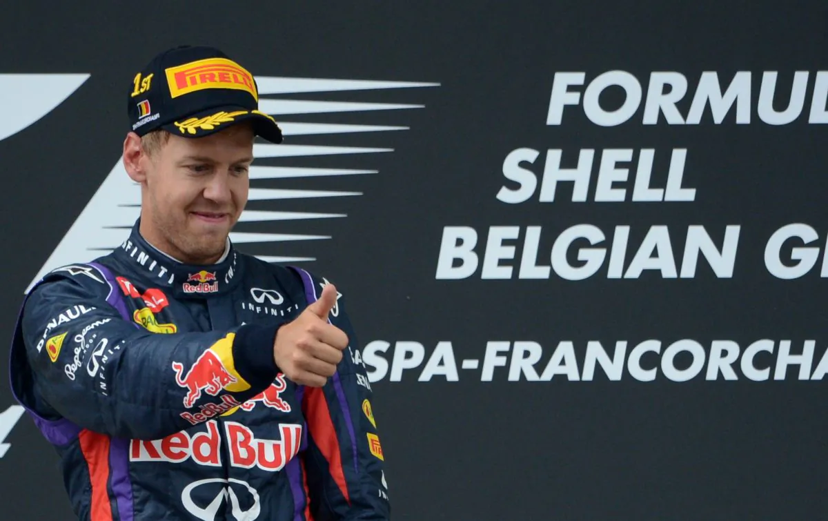 Red Bull Racing's Sebastian Vettel celebrates on the podium at the Spa-Francorchamps ciruit in Spa on August 25, 2013 after the Belgium Formula One Grand Prix. (John Thys/AFP/Getty Images)