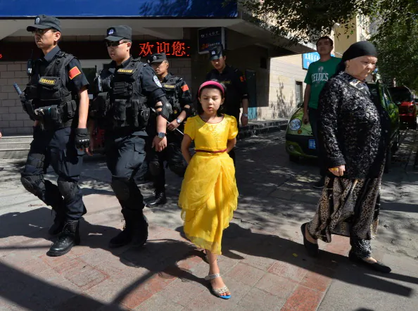 Chinese armed police patrol the streets of the Muslim Uighur quarter in Urumqi on June 29, 2013 after a series of recent terrorist attacks hit the Xinjiang region. Security forces short four Uyghurs dead recently. (Mark Ralston/AFP/Getty Images) 