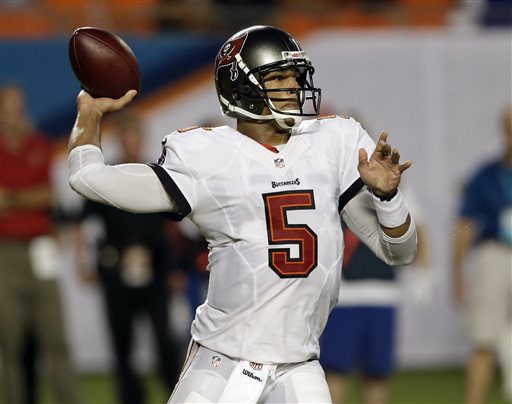 Tampa Bay Buccaneers quarterback Josh Freeman (5) looks to pass during the first half of an NFL preseason football game against the Miami Dolphins, Saturday, Aug. 24, 2013, in Miami Gardens, Fla. (AP Photo/Wilfredo Lee)