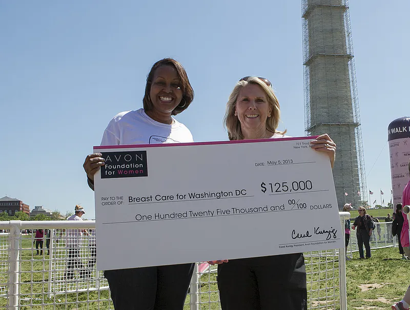 Avon Foundation for Women President Carol Kurzig presents Dr. Regina Hampton with a $125,000 grant for Breast Care for Washington at the 11th annual Avon Walk for Breast Cancer in Washington, D.C. (Avon Foundation for Women)