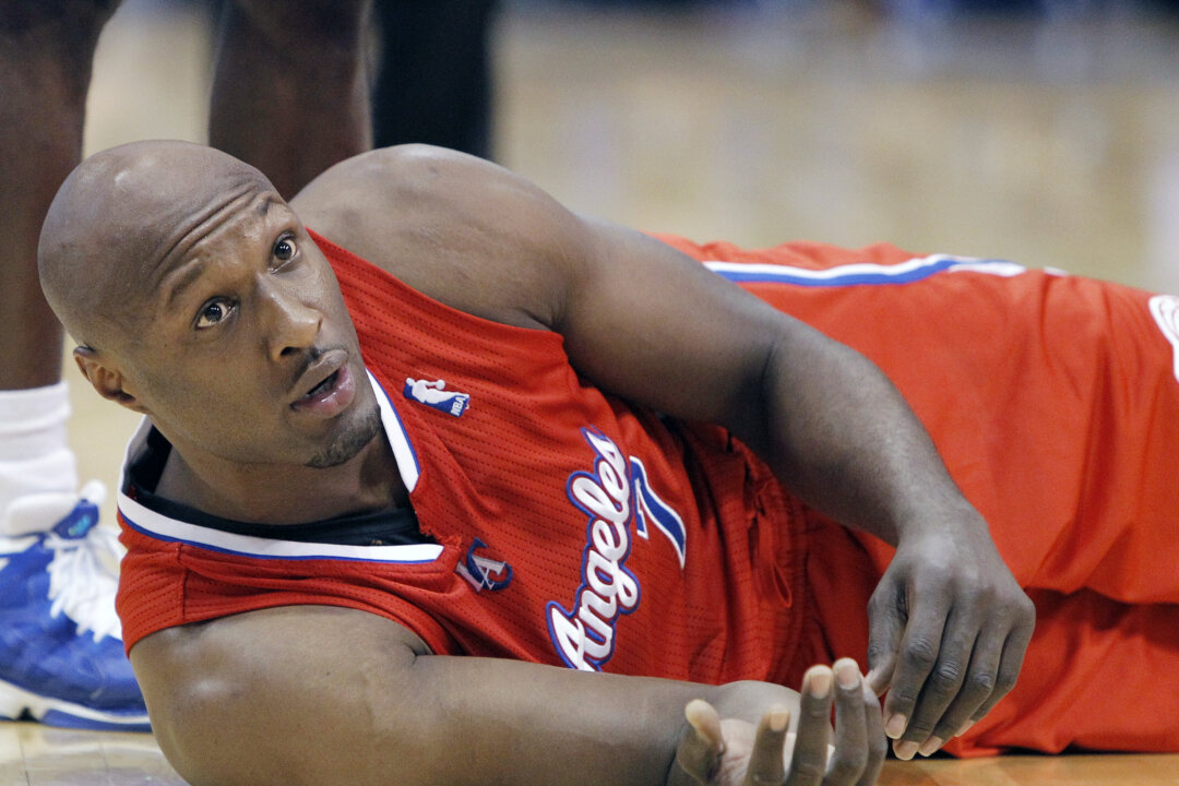 This March 26, 2013, file photo, shows Los Angeles Clippers' Lamar Odom during an NBA basketball game in Dallas. Odom was arrested for allegedly driving under the influence early Friday, Aug. 30, 2013, after a CHP officer saw his white Mercedes-Benz traveling erratically on a San Fernando Valley freeway. The CHP says Odom, 33, was arrested after failing a field sobriety test. (AP Photo/Brandon Wade, File)