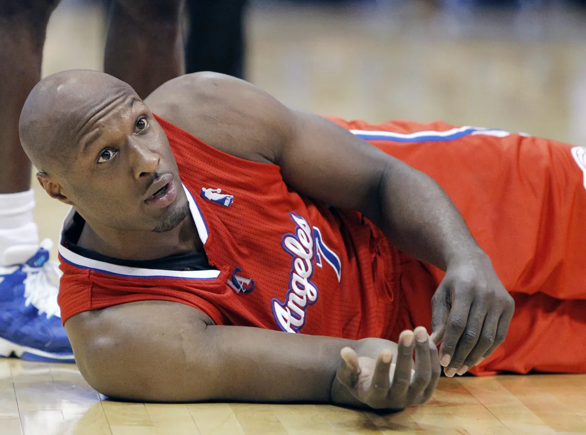 This March 26, 2013, file photo, shows Los Angeles Clippers' Lamar Odom during an NBA basketball game in Dallas. Odom was arrested for allegedly driving under the influence early Friday, Aug. 30, 2013, after a CHP officer saw his white Mercedes-Benz traveling erratically on a San Fernando Valley freeway. The CHP says Odom, 33, was arrested after failing a field sobriety test. (AP Photo/Brandon Wade, File)