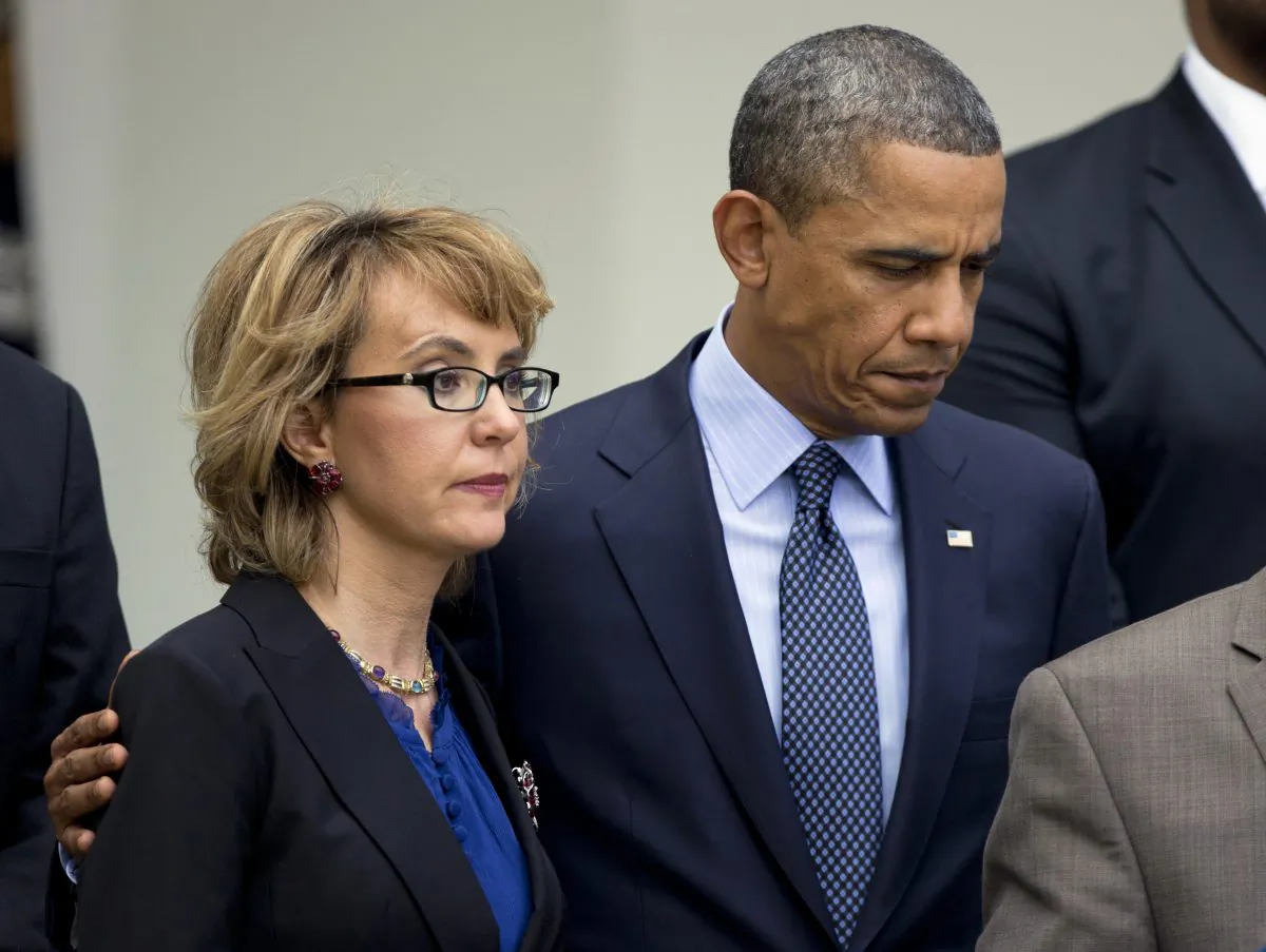In this April 17 photo, President Barack Obama stands near former Arizona Rep. Gabrielle Giffords before speaking in the Rose Garden about measures to reduce gun violence. (Manuel Balce Ceneta/AP Photo)