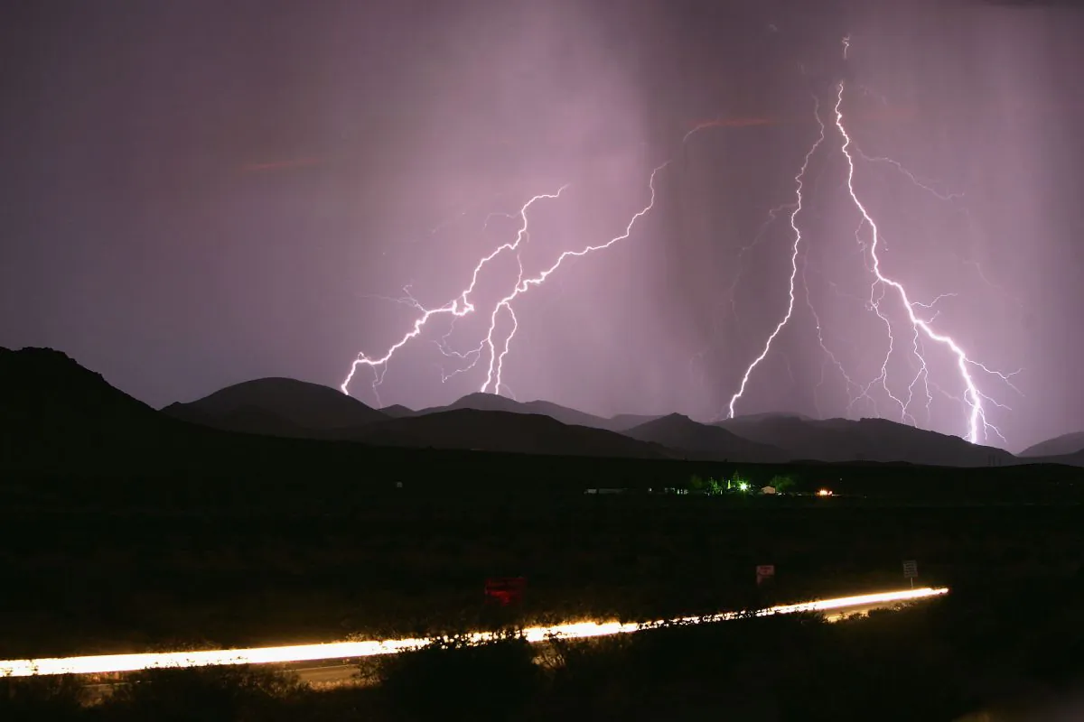 Lightning strikes, August 5, 2005, southwest of Barstow, Calif., during heavy thunderstorms. High places are deadly lightning zones to avoid in storms. (David McNew/Getty Images) 