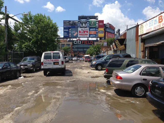 Auto repair shops line a Willets Point street leading to the Citi Field bullpen gate on August 2, 2013. (Ivan Pentchoukov/Epoch Times)
