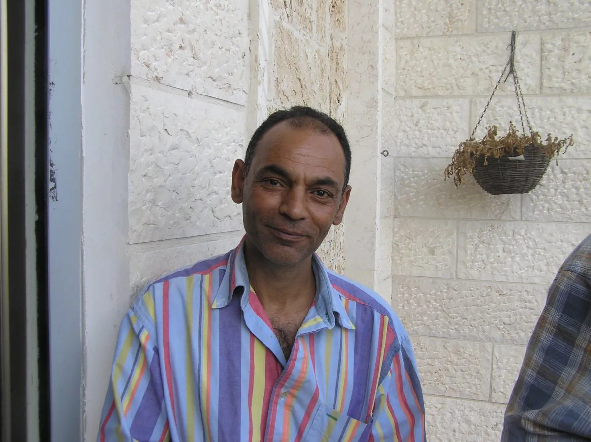 Badiz'a Ahmed lives in a village near the Palestinian city of Tul Karem, West Bank. Road to Recovery volunteers provided transport for him and his children to a hospital in Haifa. (Marlene-Aviva Grunpeter/Epoch Times) 