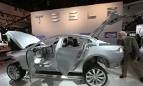 Tesla Comes Under Fire in China After Woman Protests at Auto Show
