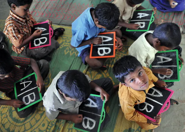 Indian school children write alphabets on slates at a government primary school in the outskirts of Hyderabad on June 13, 2011. India has lost almost 250 languages in the last 50 years, but still continues to have four times the languages spoken in Europe according to a recent survey. (NOAH SEELAM/AFP/Getty Images)