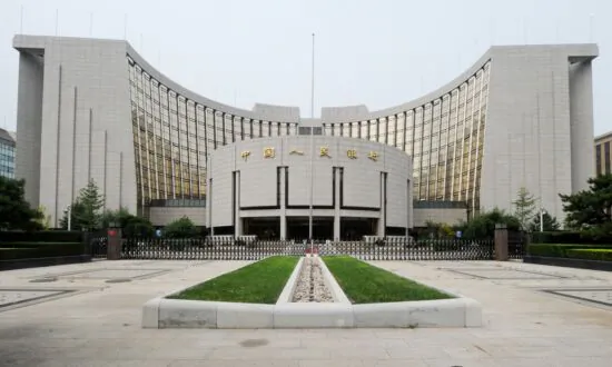 China Cuts Lending Benchmarks to Revive Faltering Economy