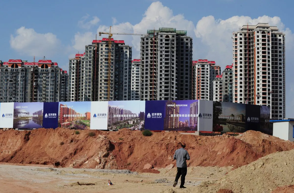 Empty apartment developments stand in the city of Ordos, Inner Mongolia on Sept. 12, 2011. The city which is commonly referred to as a "ghost city" due to it's lack of people, is being built to house 1.5 million inhabitants and has been dubbed the Dubai of China by locals. (Mark Ralston/AFP/Getty Images)