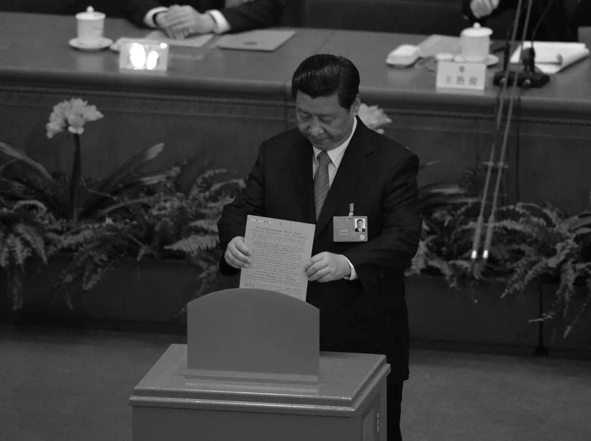 Communist party general secretary Xi Jinping votes during the election of new officials during the 12th National People's Congress in the Great Hall of the People in Beijing on March 16, 2013. A report by Asia Sentinel indicates that his doctoral thesis may have been plagiarized. (Mark Ralston/AFP/Getty Images)