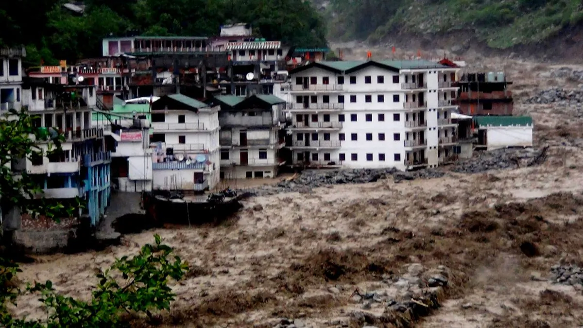 Fast moving water from the  Alaknanda river destroys building during a heavy monsoon rain in Govindghat town in the Indian state of Uttrakhand on June 17, 2013. Environmental engineer G. D. Agarwal started an indefinite fast to stress his demand for the government to scrap all hydro projects on the Bhagirathi, Alaknanda, and Mandakini head-streams of the Ganges.(STRDEL/AFP/Getty Images)