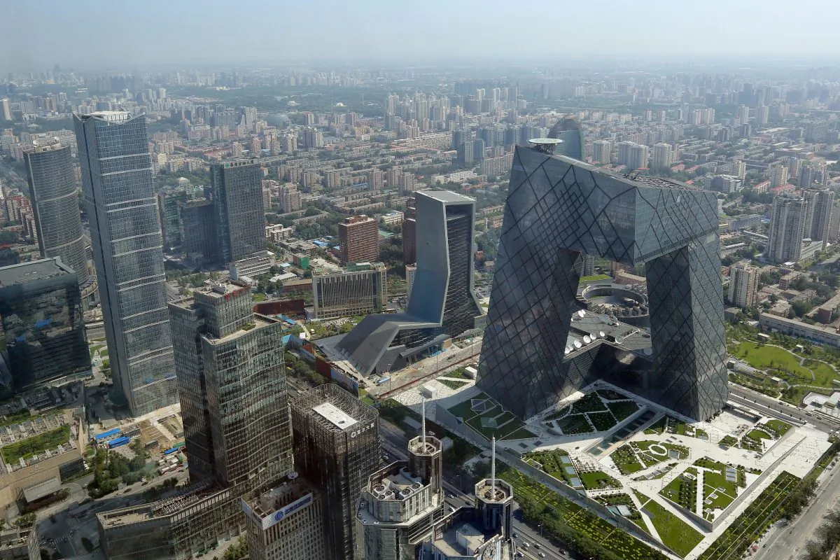 The headquarters of China Central Television stands out amidst the skyline of Beijing's central business district, Aug. 3, 2013. Beijing is plagued by traffic jams, environmental degradation, dwindling water resources, waste management problem, as well as annual sand storms. (Feng Li/Getty Images)
