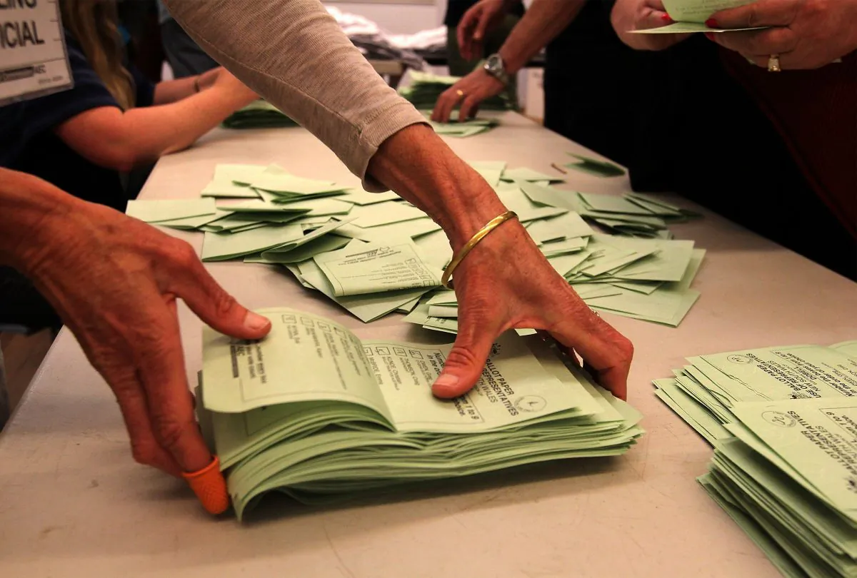 Staff tally ballot papers at Tuggerah Public School in the electorate of Dobell on election day in Gosford, Australia, on Sept. 7, 2013 . Voters head to the polls today to elect the 44th parliament of Australia. (Photo by Tony Feder/Getty Images)