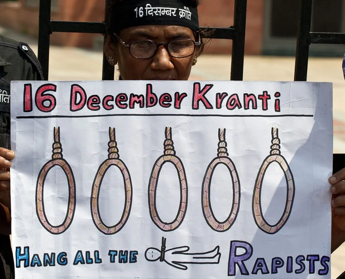 An Indian woman holds a placard demanding the death sentence  during a protest outside the Saket Court complex in New Delhi on September 11, 2013.   Delhi Court sentenced the four convicted for rape and murder to death on Friday. (MANAN VATSYAYANA/AFP/Getty Images)