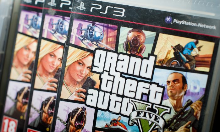 GTA 5 Heists--the belated DLC that's been promised for nearly a year--could be coming soon. Grand Theft Auto V, coming for the PC, PS4, and Xbox One in the fall, will finally allow users to use mods for the PC. The console game “Grand Theft Auto V” at a HMV music store in London, England, Sept. 17. (LEON NEAL/AFP/Getty Images)