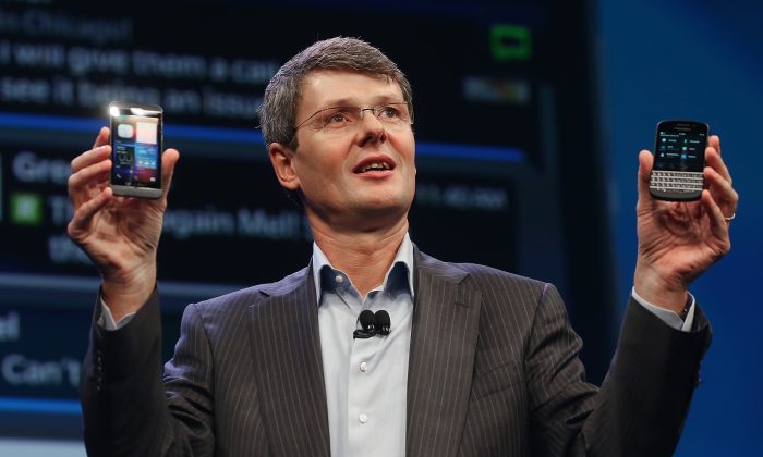 BlackBerry CEO Thorsten Heins displays the new Blackberry 10 smartphones at the BlackBerry 10 launch event held by Research in Motion in Manhattan on Jan. 30, 2013, in New York City. (Mario Tama/Getty Images)