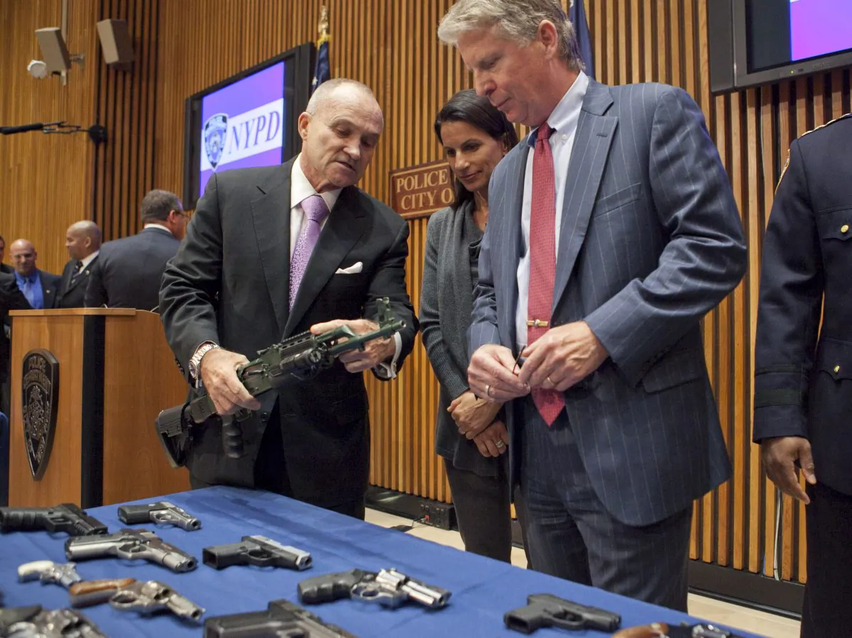NYPD Commissioner Ray Kelly holds an AK 47 at 1 Police Plaza on Sept. 19. (Samira Bouaou/Epoch Times)