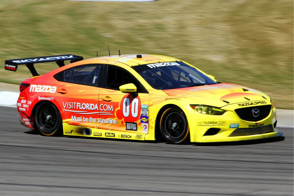 The #00 Visit Florida SpeedSource Mazda of Tristan Nunez and Joel Miller races at Barber Motorsports Park earlier this year. The pair has four class wins and are after their fifth this Sunday. (Chris Jasurek/Epoch Times)