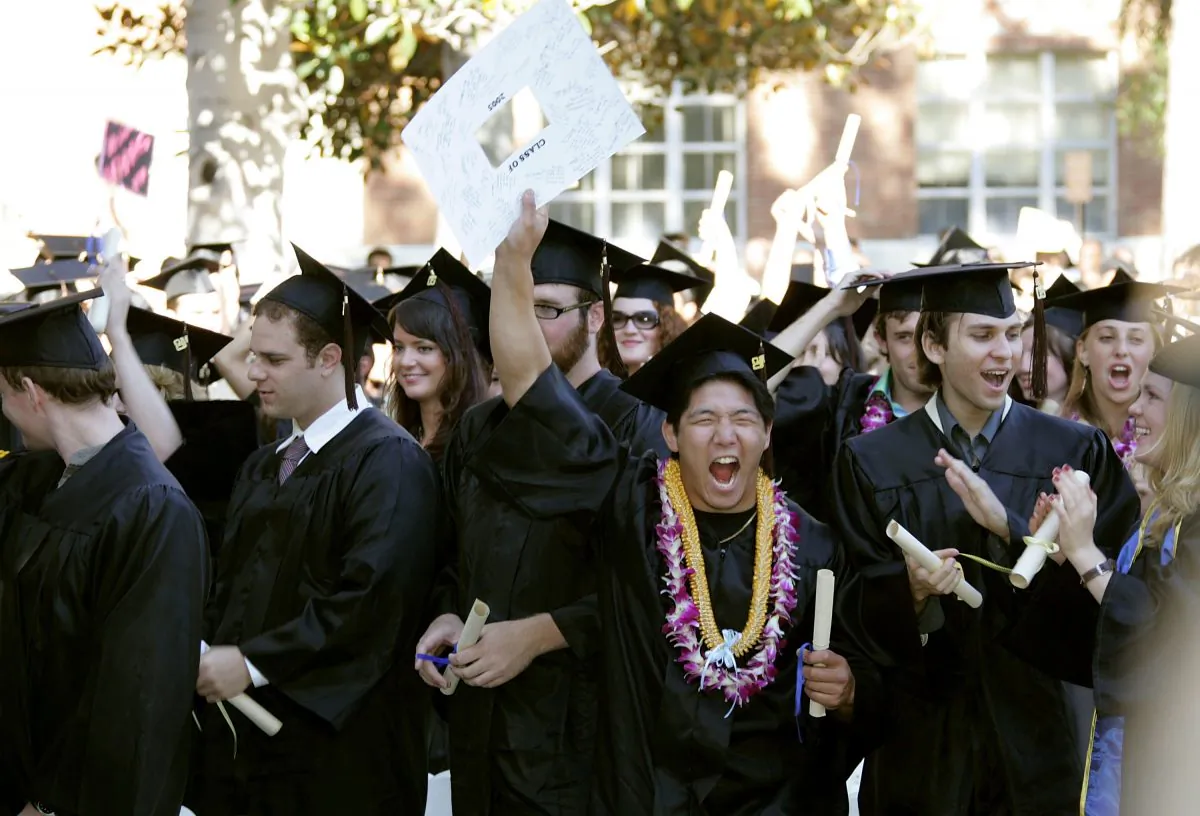 Students celebrate at the commencement ceremony at UCLA's School of Theater, Film and Television on June 17, 2005 in Los Angeles, California. (Photo by Frazer Harrison/Getty Images)