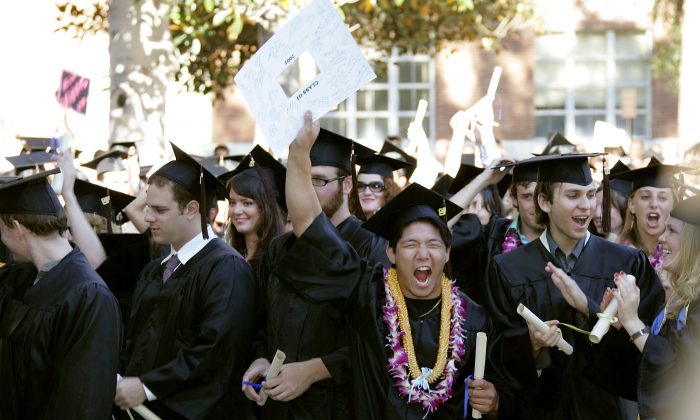 Students celebrate at the commencement ceremony at UCLA's School of Theater, Film and Television on June 17, 2005 in Los Angeles, California. (Photo by Frazer Harrison/Getty Images)