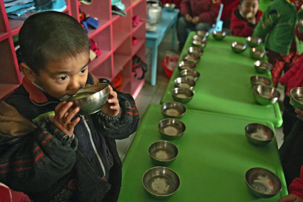 Photo taken on Nov. 27, 2007, showing a child in Henan Province, where life in his village has returned to 1960s China, having rejected market reforms and returned to a collective economy with villagers working for the good of the community. A communist official in western China has apparently laid claim to fathering half the children in his village with "left behind" wives whose husbands have to go to cities to get work. (Peter Parks/AFP/Getty Images)