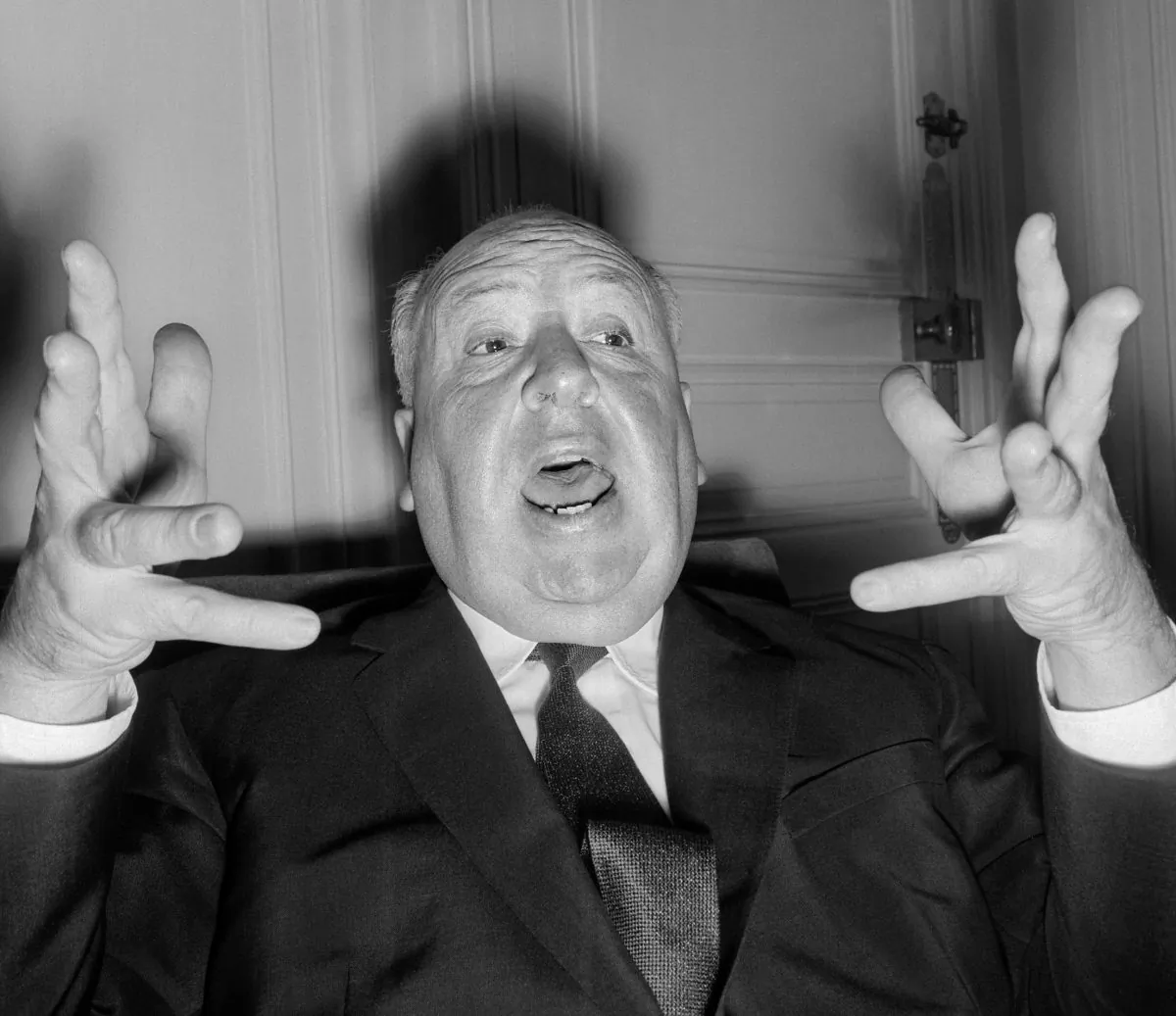 British film director Alfred Hitchcock (1899-1980) gestures as he gives a press conference in Paris to present his last movie 'Psycho' 18 October 1960. Given his chosen genre, it is a strange coincidence that he would have turned 100 years old on a Friday 13th. (STF/AFP/Getty Images)