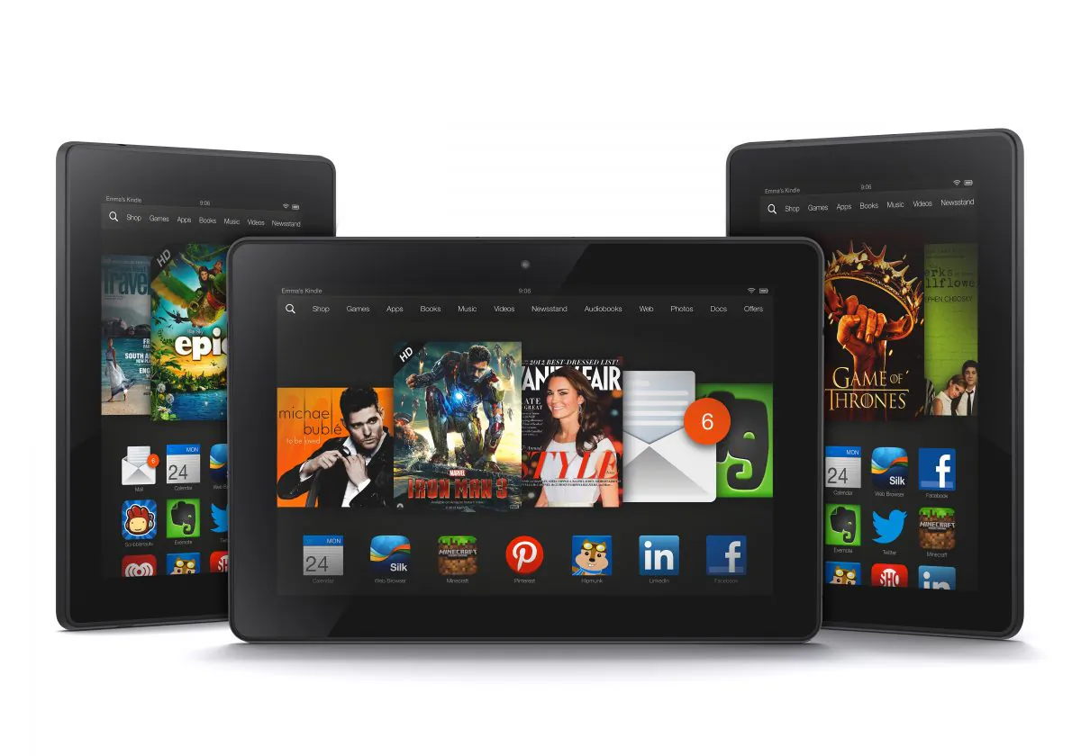 The new 8.9-inch Amazon Kindle HDX tablet computer, center, the 7-inch Kindle HDX, left, and the updated Kindle HD. (AP Photo/Amazon.com)