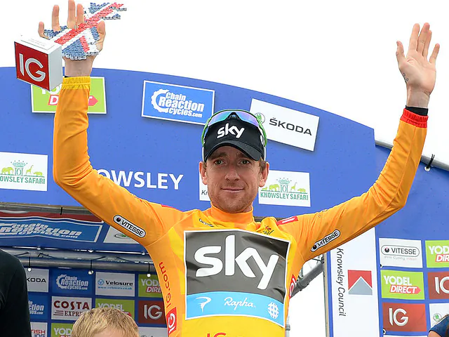 Sir Bradley Wiggins wears the race leader’s yellow jersey after winning the Stage Three time trial of the Tour of Britain. (teamsky.com)