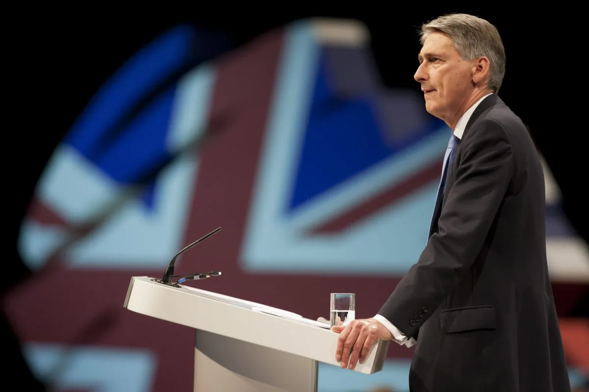 Defense Secretary Philip Hammond speaks at Britain's Conservative Party Conference, Manchester, England, Sunday, Sept. 29, 2013. (AP Photo/Jon Super)