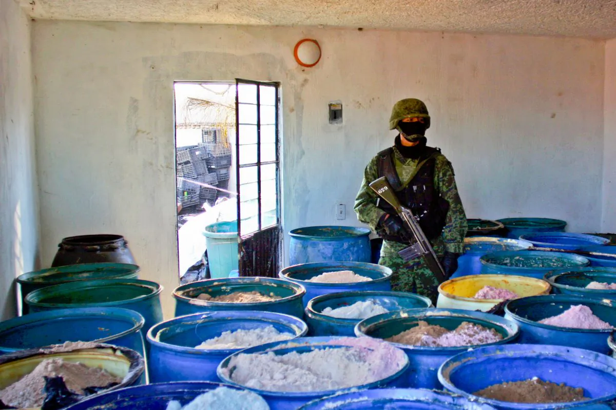A soldier stands guard inside a clandestine chemical drug processing laboratory discovered in Mexico on Feb. 9, 2012. Chinese gangs are supplying Mexican drug cartels with chemicals to create illicit substances, for sale in the United States. (Hector Guerrero/AFP/Getty Images)