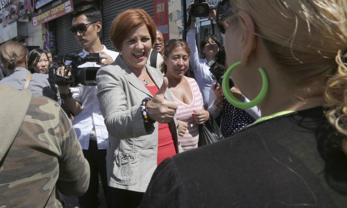 New York City Democratic mayoral hopeful and City Council Speaker Christine Quinn gives a woman a thumbs up during a campaign stop in the Bronx borough of New York, Sept. 5, 2013. (Mary Altaffer/AP Photo)