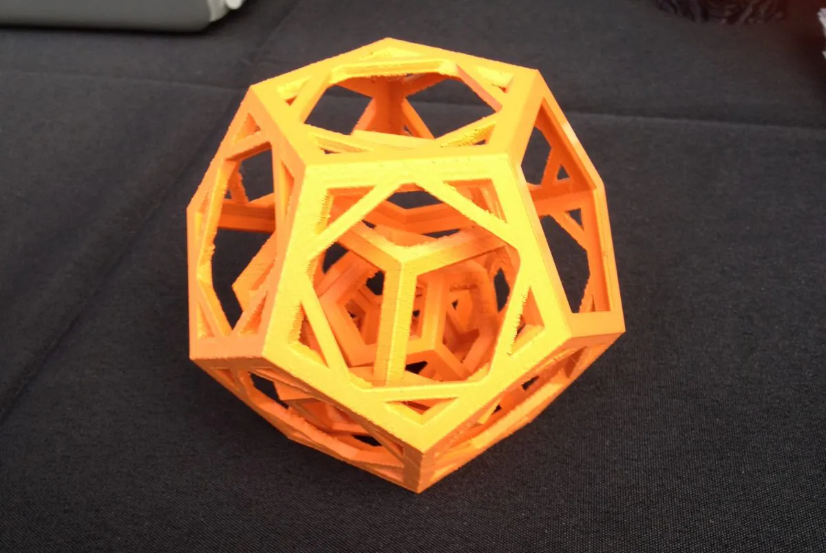 An example of advanced 3D printing at the Simplify3D booth at Maker Faire in Queens, N.Y., September 21. There are three dodecahedra (12-sided figures) nested together, all separate. (Ben Bendig/The Epoch Times)