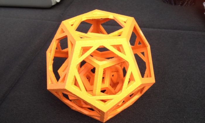 An example of advanced 3D printing at the Simplify3D booth at Maker Faire in Queens, N.Y., September 21. There are three dodecahedra (12-sided figures) nested together, all separate. (Ben Bendig/The Epoch Times)