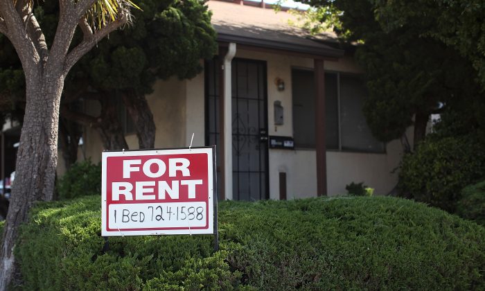 A "For Rent" sign is posted in front of a house in Richmond, Calif. in June 2012. (Justin Sullivan/Getty Images)
