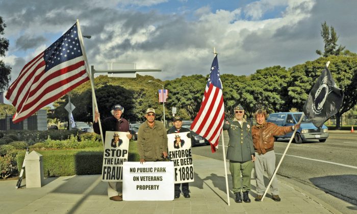 (L-R) Robert Rosebrock, Gil Flores, Hank Papeika, Larry Kegel, and David Bischoff, members of the Old Veterans Guard on Wilshire Boulevard., Dec. 9, 2012. Members of the group have protested illegally controlled land on the VA campus every Sunday since 2008, enduring extreme weather and military police harassment, an arrest, and a lawsuit. (Robin Kemker/Epoch Times)