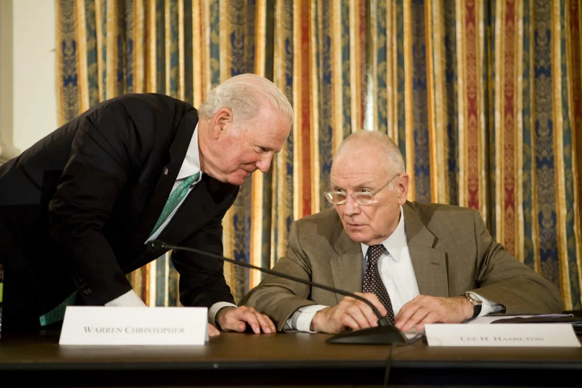 Former Secretary of State James A. Baker III (L) consults with former Rep. Lee Hamilton before a news conference releasing the findings of the National War Powers Commission on Capitol Hill, in Washington, D.C., on July 8, 2008. The bipartisan commission, which Baker chaired with fellow former Secretary of State Warren Christopher, recommended repeal of the War Powers Act and closer consultation between the White House and Congress in initiating combat. (Brendan Hoffman/Getty Images) 