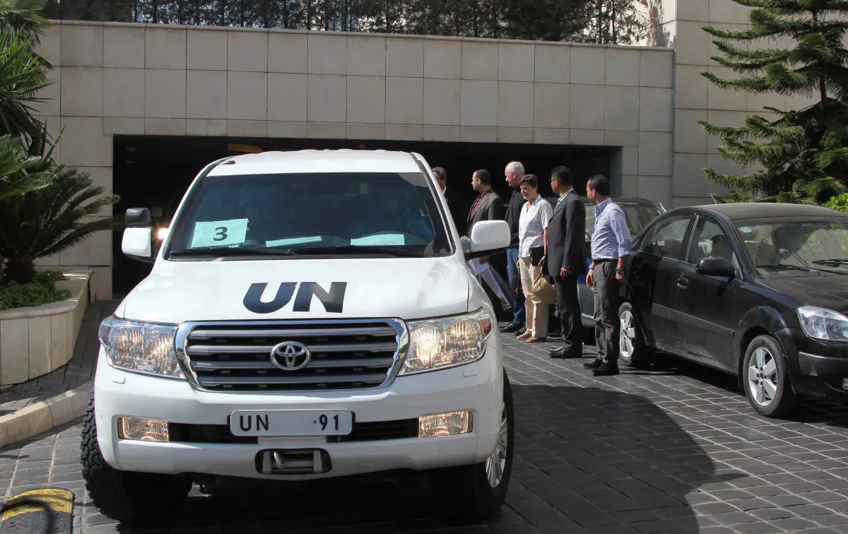 U.N. inspectors leave a Damascus hotel to go to the site of a chemical weapons attack, Aug. 28. (STR/AFP/Getty Images)