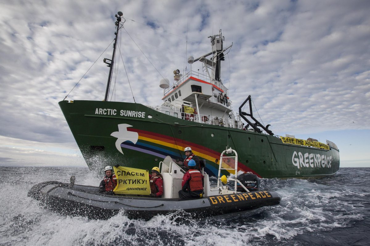 The Greenpeace ship Arctic Sunrise enters the Northern Sea Route (NSR) off Russia's coastline to protest against Arctic oil drilling, Saturday, Aug. 24, 2013. The sign reads "Save the Arctic!" The group is protesting offshore oil exploration adjacent to Russia's Arctic National Park, which is habitat for polar bears, walrus and other animals. The exploration is being conducted by state oil company Rosneft and ExxonMobil. (AP Photo/Will Rose, Greenpeace)