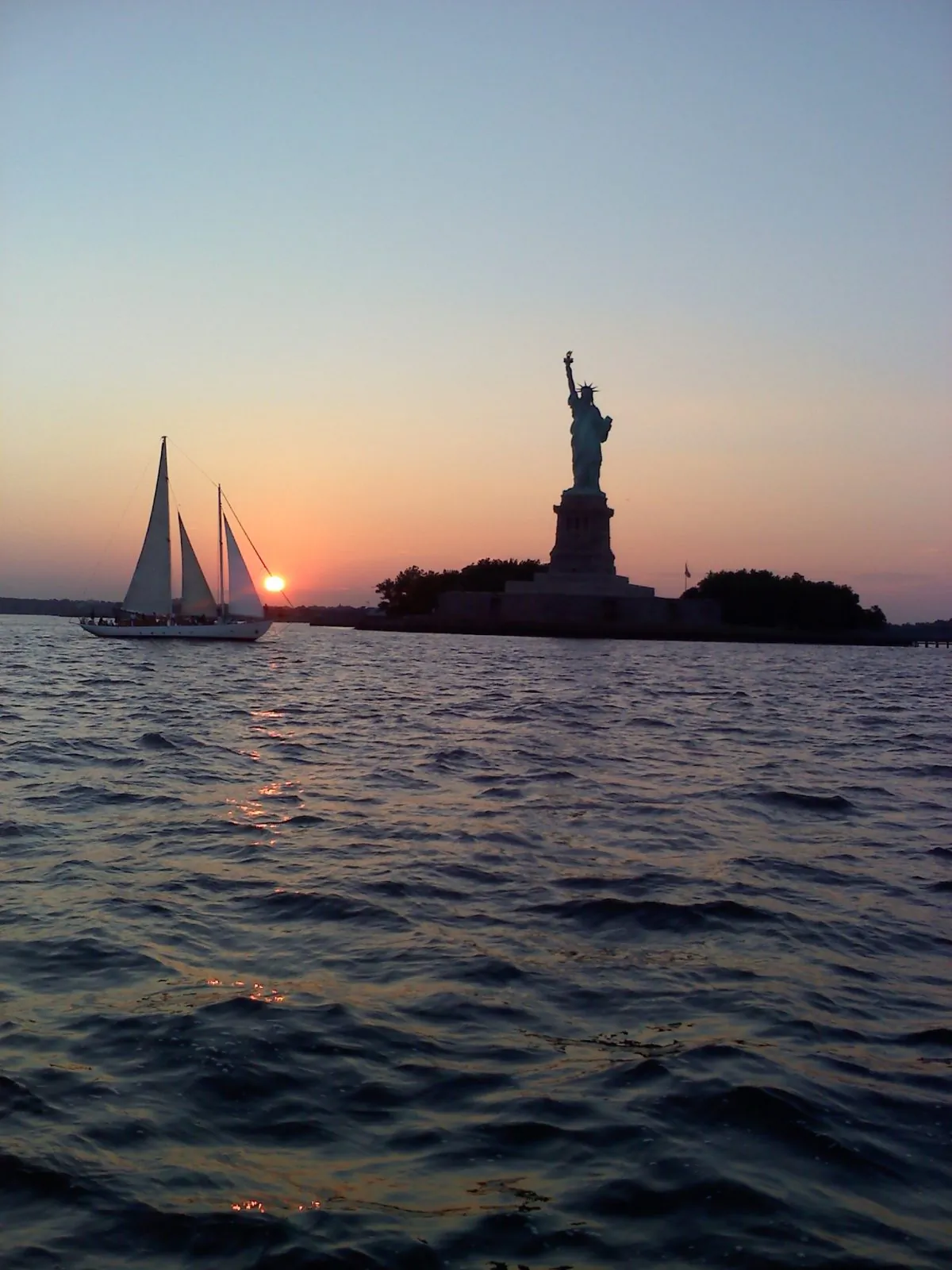 The Statue of Liberty at Sunset from NJ's Official Tall Ship The A.J. Meerwald (C.Hoernlein)