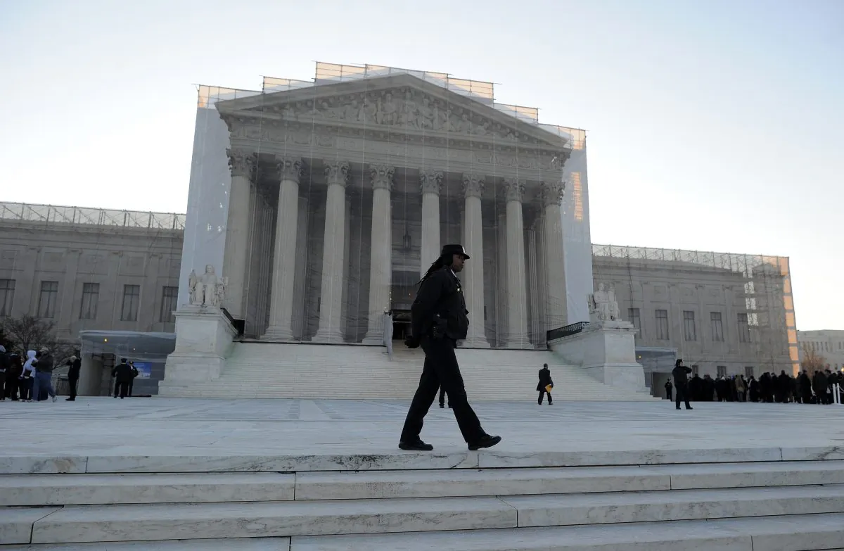 A policewoman stands at her post in front of the Supreme Court in Washington, D.C., March 27, 2013. (Jewel Samad/AFP/Getty Images)