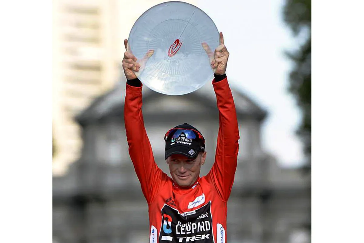 RadioShack’s Chris Horner brandishes the race winner’s trophy on the podium in Madrid after winning the 2013 Vuelta a España. (radioshackleopardtrek.com)