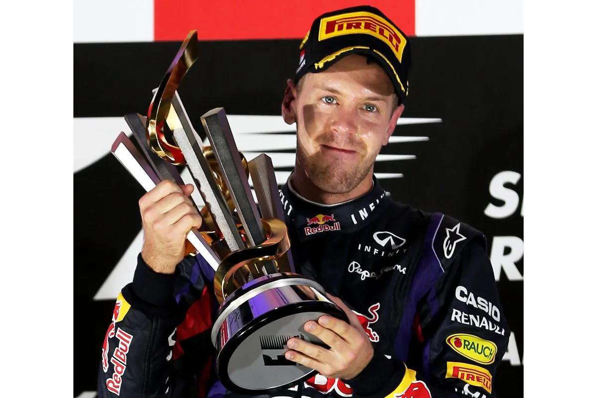 Sebastian Vettel of Red Bull Racing lifts the trophy following his victory during the Formula One Singapore Grand Prix at Marina Bay Street Circuit on September 22, 2013 in Singapore, Singapore. (Mark Thompson/Getty Images)
