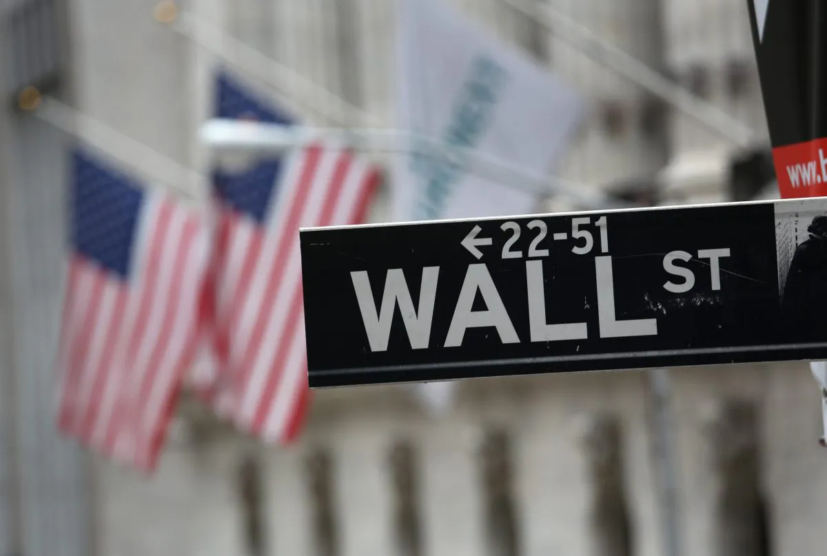 Wall Street outside the New York Stock Exchange on Sept. 16, 2013. Five years after the beginning of the financial crisis marked by the bankruptcy of Lehman Brothers, Wall Street has more than recovered its losses, although unemployment in the United States remains high. (John Moore/Getty Images)