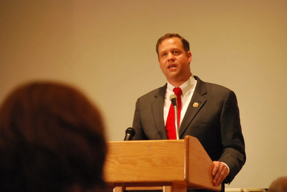 Congressman Jim Bridenstien (R-Okla.) recounts his visit to the demilitarized zone between North and South Korea at the Survivors of Communism Summit in Alexandria, Va. on Sept. 10. (Ron Dory/Epoch Times)