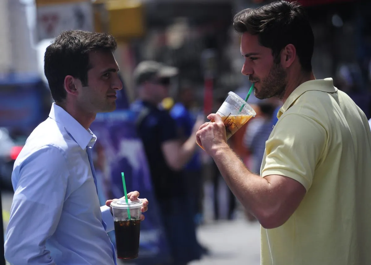 Drinking and discussing in New York on May 31, 2012. (Emmanuel Dunand/AFP/GettyImages)