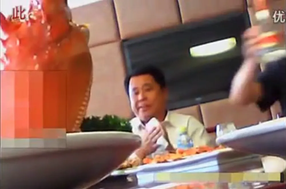 Screenshot from a video showing a Party secretary criticizing Chinese citizens at an expensive banquet in Hebei Province on May 20, 2013. (Screenshot/Epoch Times)