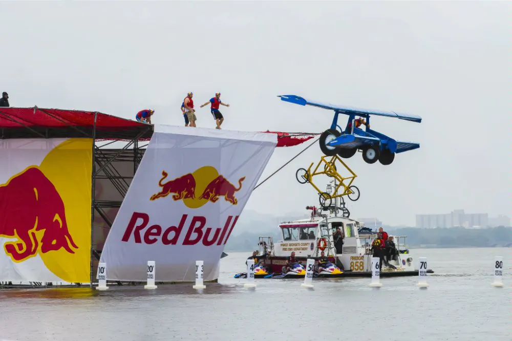 First place team Harvest Bureau from New Holland, Pennsylvania launch their ' angry tractor with wings' off of the 24 foot high platform at the National Red Bull Flugtag DC at the National Harbor on Sept. 21. ( Photo/ Red Bull USA)