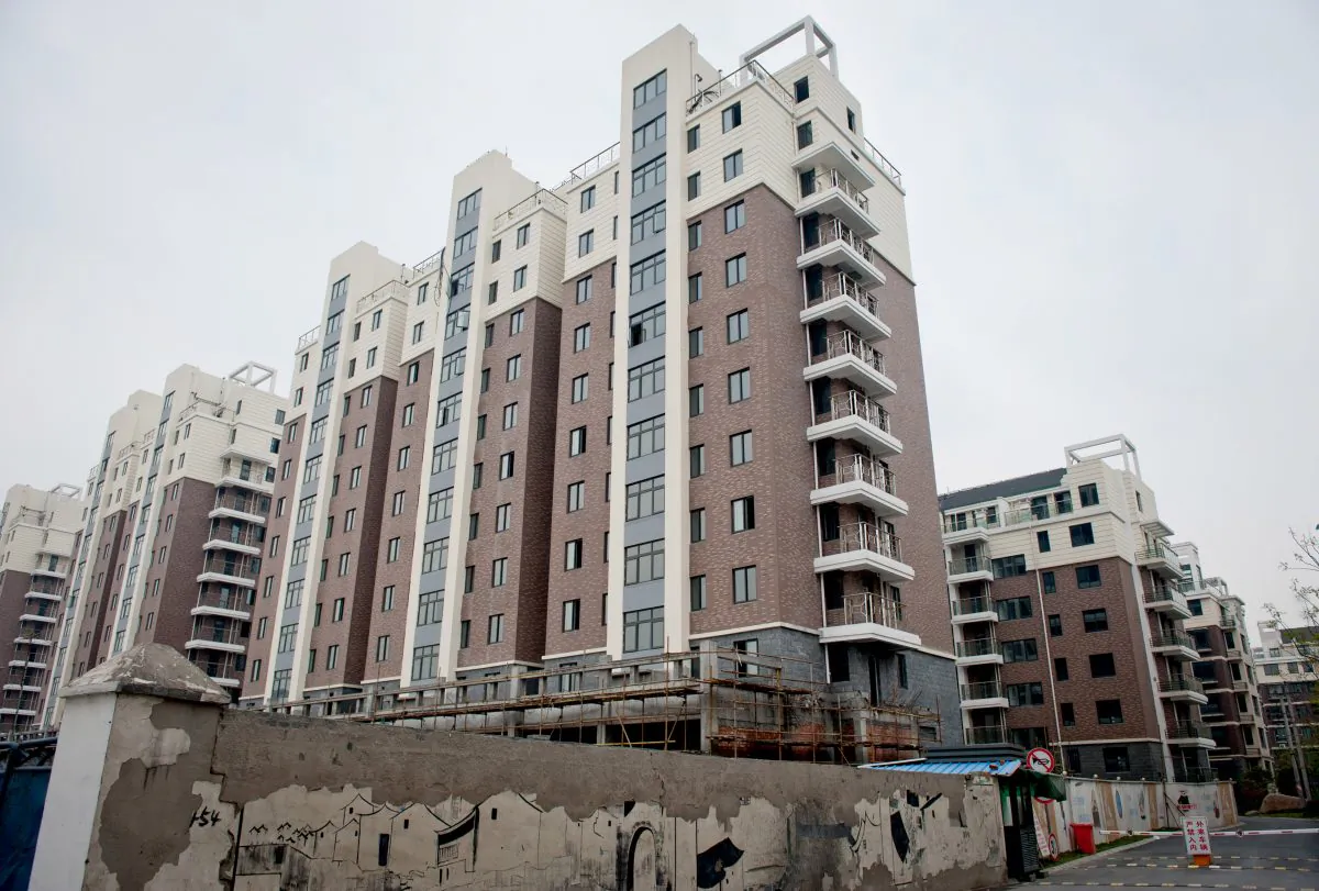 A group of apartments that were built in Hangzhou, capital of Zhejiang Province, sit vacant, as the construction company has gone bankrupt, on on April 10, 2012. Also in Hangzhou, the developer China Metallurgical Group Corporation faces huge losses, as the local governments do not have the money to pay off debts to the company. (STR/AFP/Getty Images)
