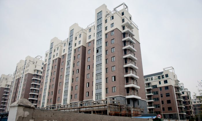 A group of apartments that were built in Hangzhou, capital of Zhejiang Province, sit vacant, as the construction company has gone bankrupt, on on April 10, 2012. Also in Hangzhou, the developer China Metallurgical Group Corporation faces huge losses, as the local governments do not have the money to pay off debts to the company. (STR/AFP/Getty Images)